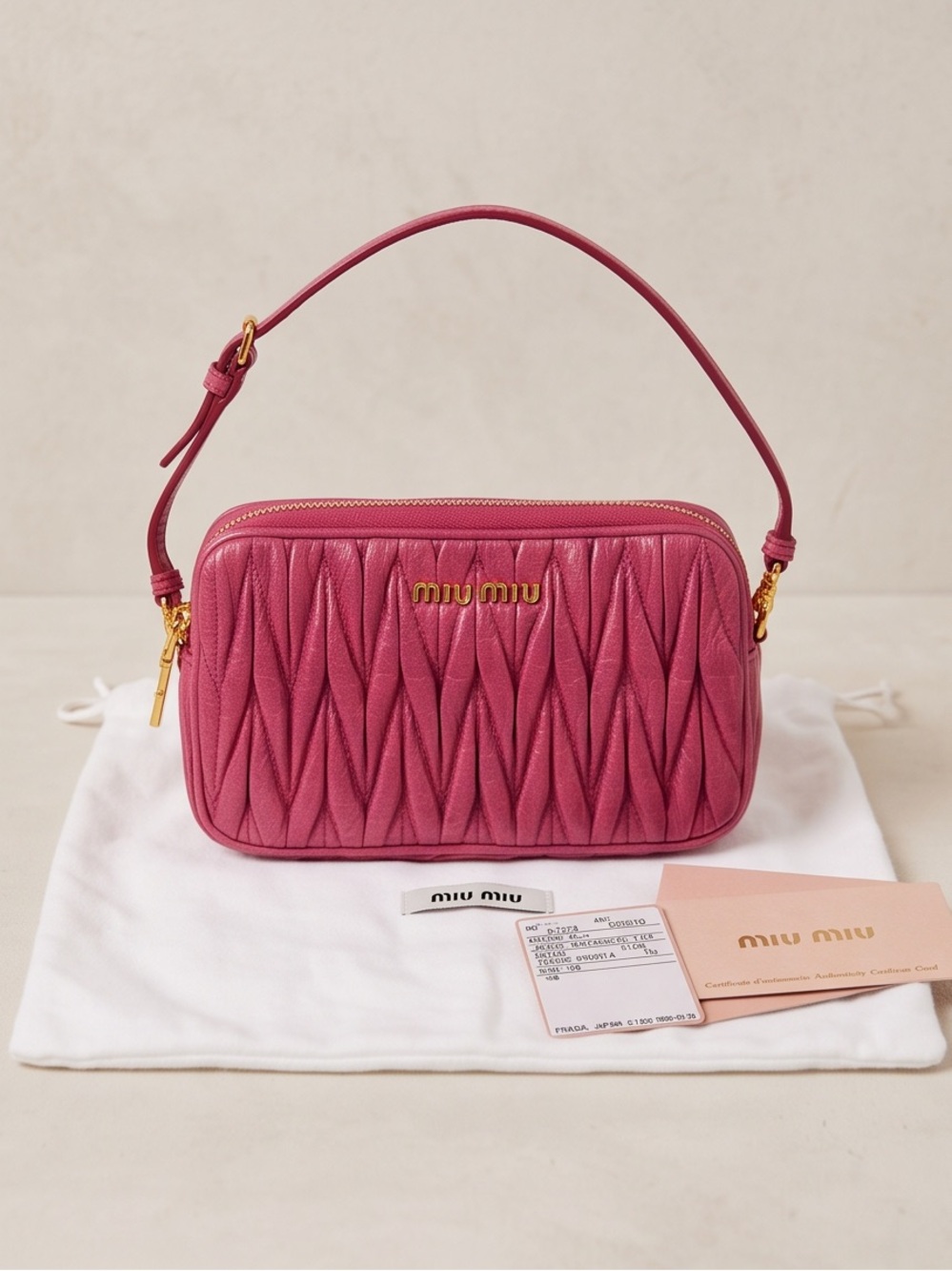 Miu Miu Pink Matelassé wristlet clutch